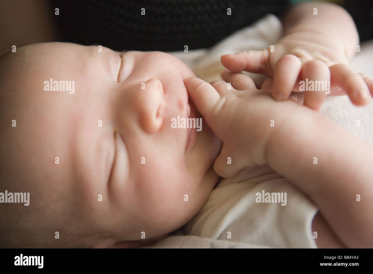 Baby born with cheap hand on face