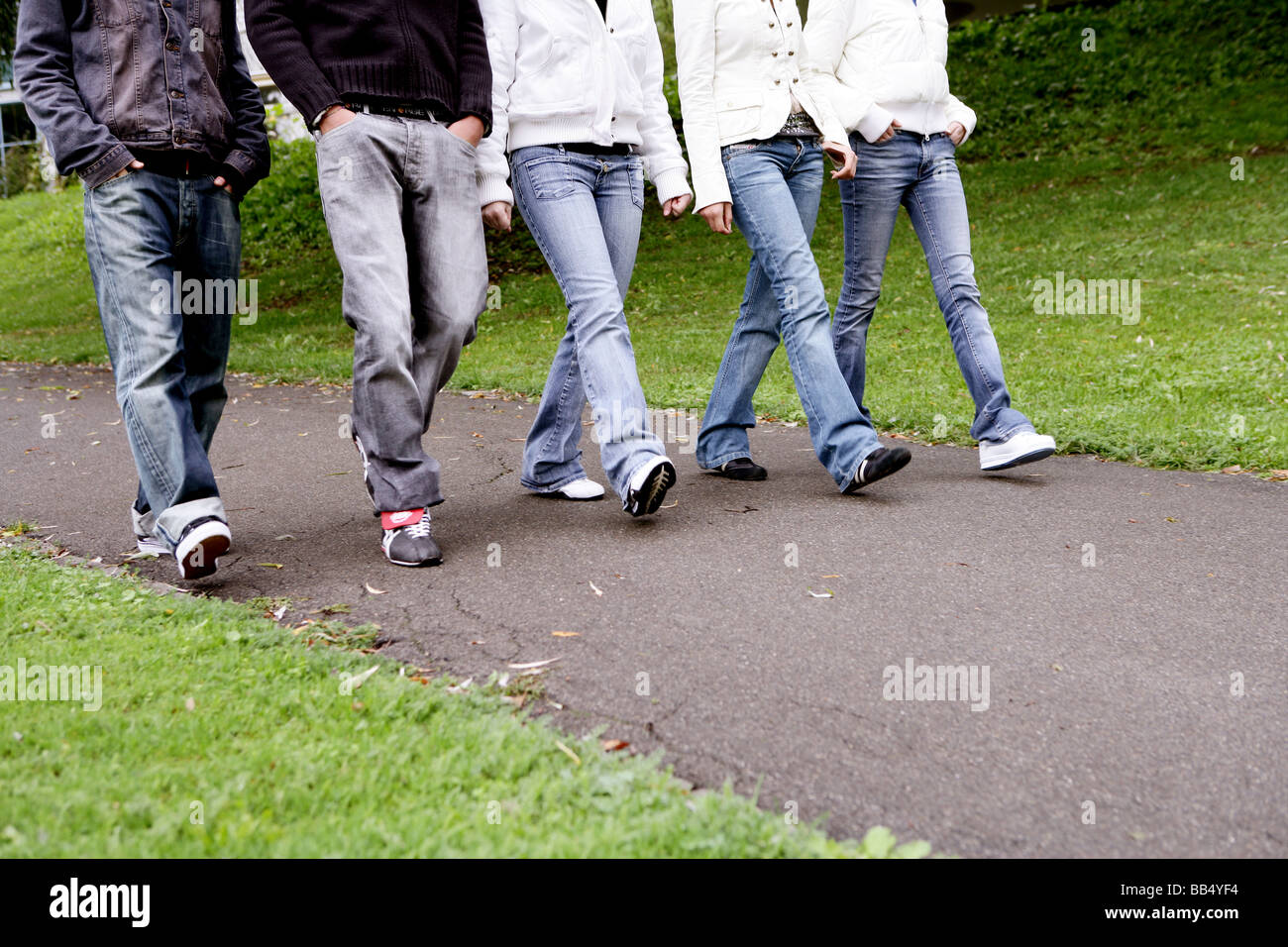 Teenager Group Walking In Park Stock Photo Alamy