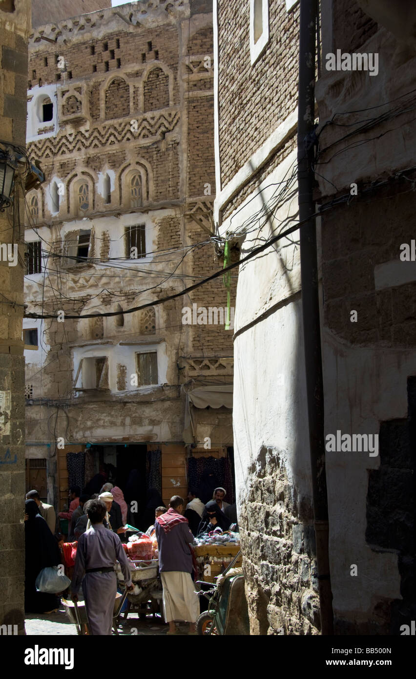 Alley with traditional buildings in the old town district of Sana'a Yemen Stock Photo