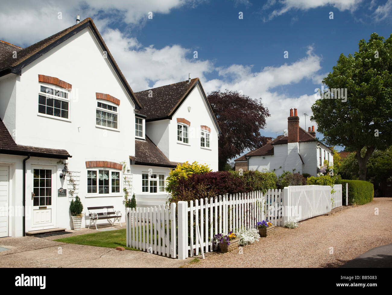 England Berkshire Bray Village Bettoney Vere row of white painted suburban houses with white picket fence Stock Photo