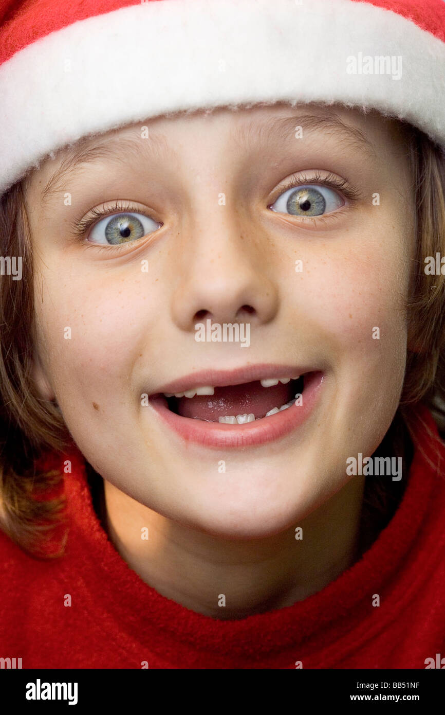 boy missing two front teeth wearing a christmas hat stock image - All I Want For Christmas Is My Two Front Teeth boy missing two front teeth wearing a christmas hat stock image - All I Want For Christmas Is My Two Front Teeth