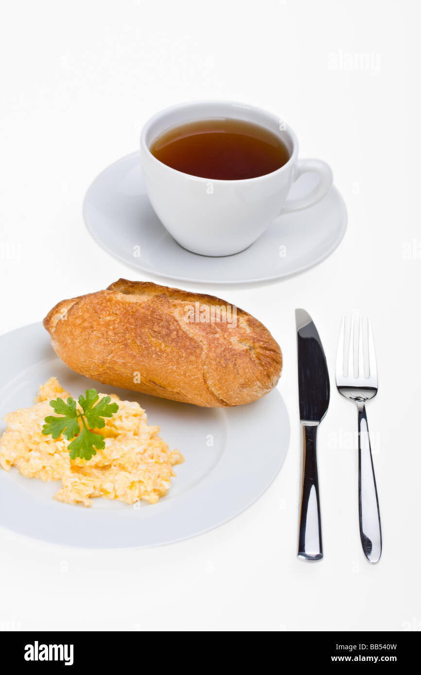scrambled eggs and bun on a plate Stock Photo - Alamy