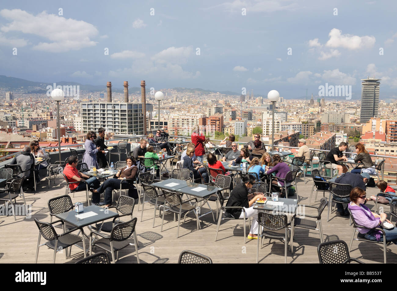 People in a cafe with a nice view over the city of Barcelona, Spain Stock Photo