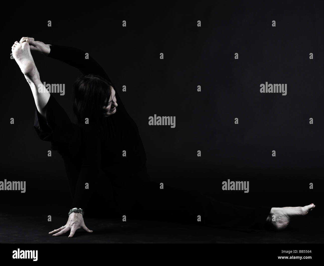 yoga pose holding foot with hand Stock Photo Alamy