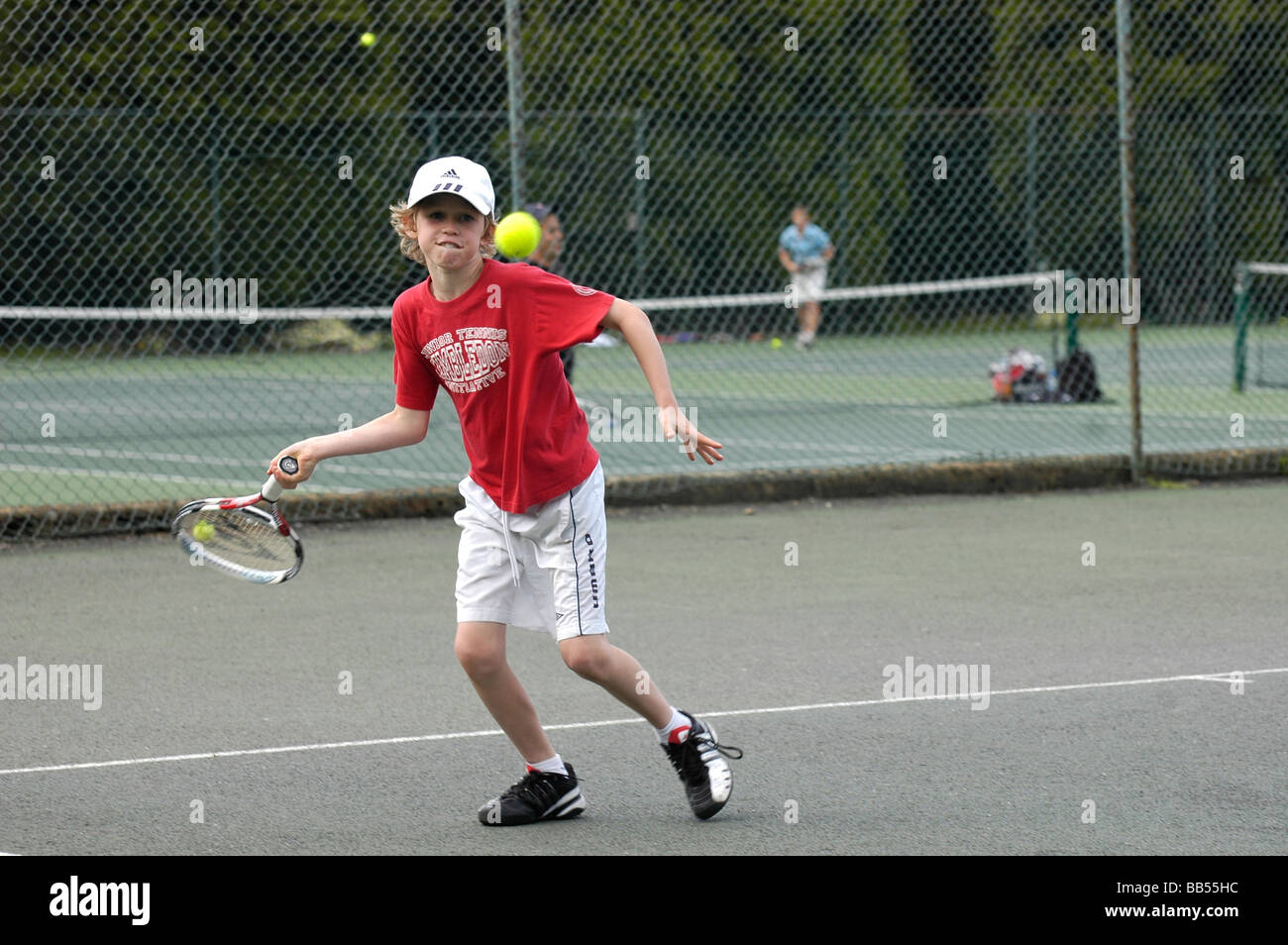 A ten year old boy playing tennis Stock Photo Alamy