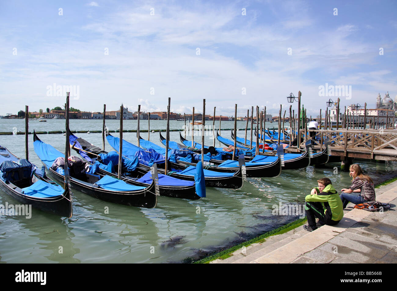 Gondolas on canalside moorings, Grand Canal, Venice, Venice Province, Veneto Region, Italy Stock Photo