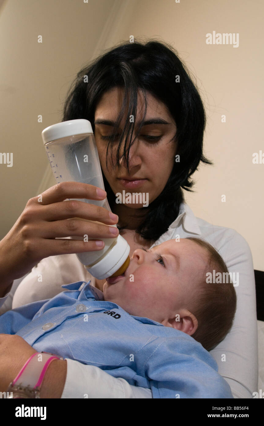 6 Month Old Baby Drinking Milk From Bottle Stock Photo Alamy