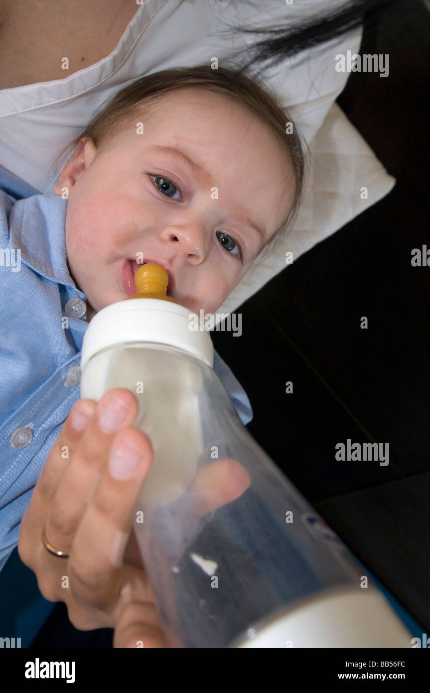 6 Month Old Baby Drinking Milk From Bottle Stock Photo Alamy
