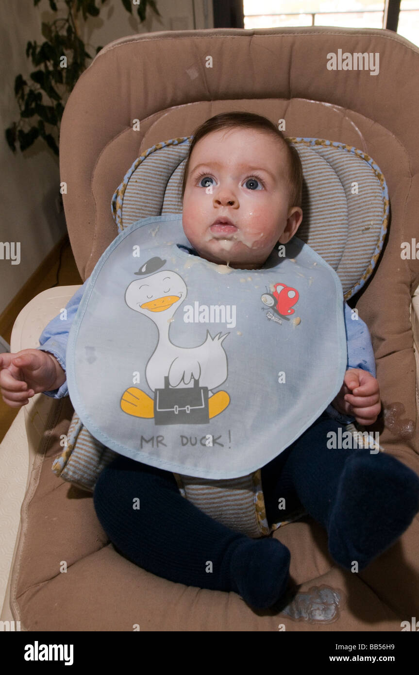 six month old baby eating baby food Stock Photo - Alamy