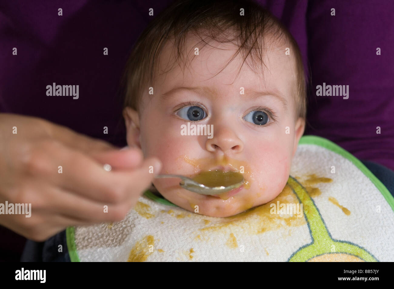 six month old baby eating soup Stock Photo Alamy
