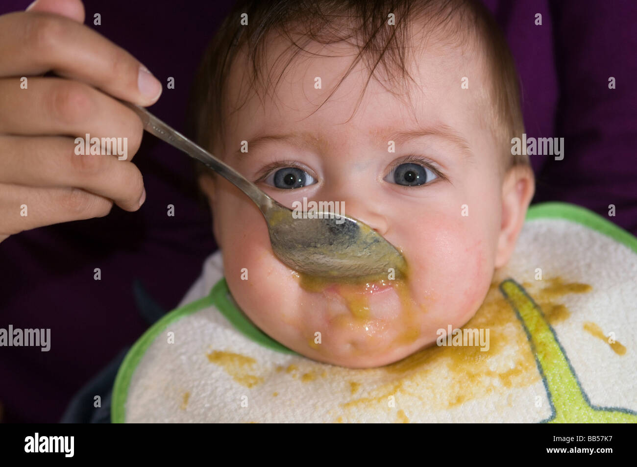six month old baby eating soup Stock Photo Alamy