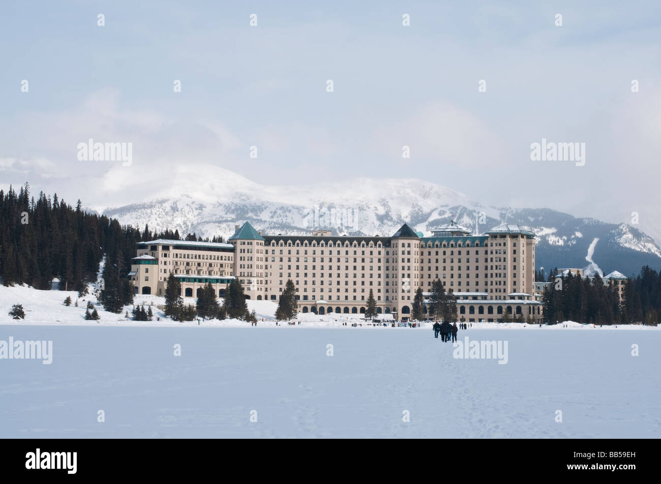 The Fairmont Chateau Lake Louise hotel surrounded by snow covered ...