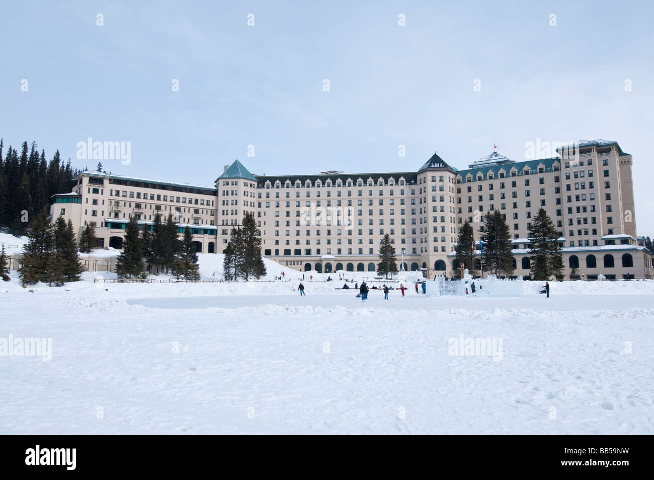 The Fairmont Chateau Lake Louise hotel surrounded by snow covered ...