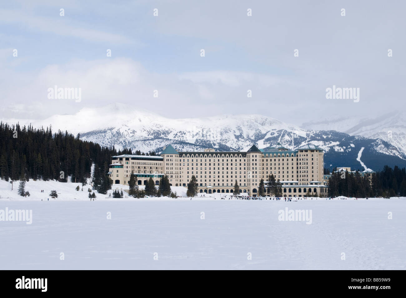 The Fairmont Chateau Lake Louise hotel surrounded by snow covered ...