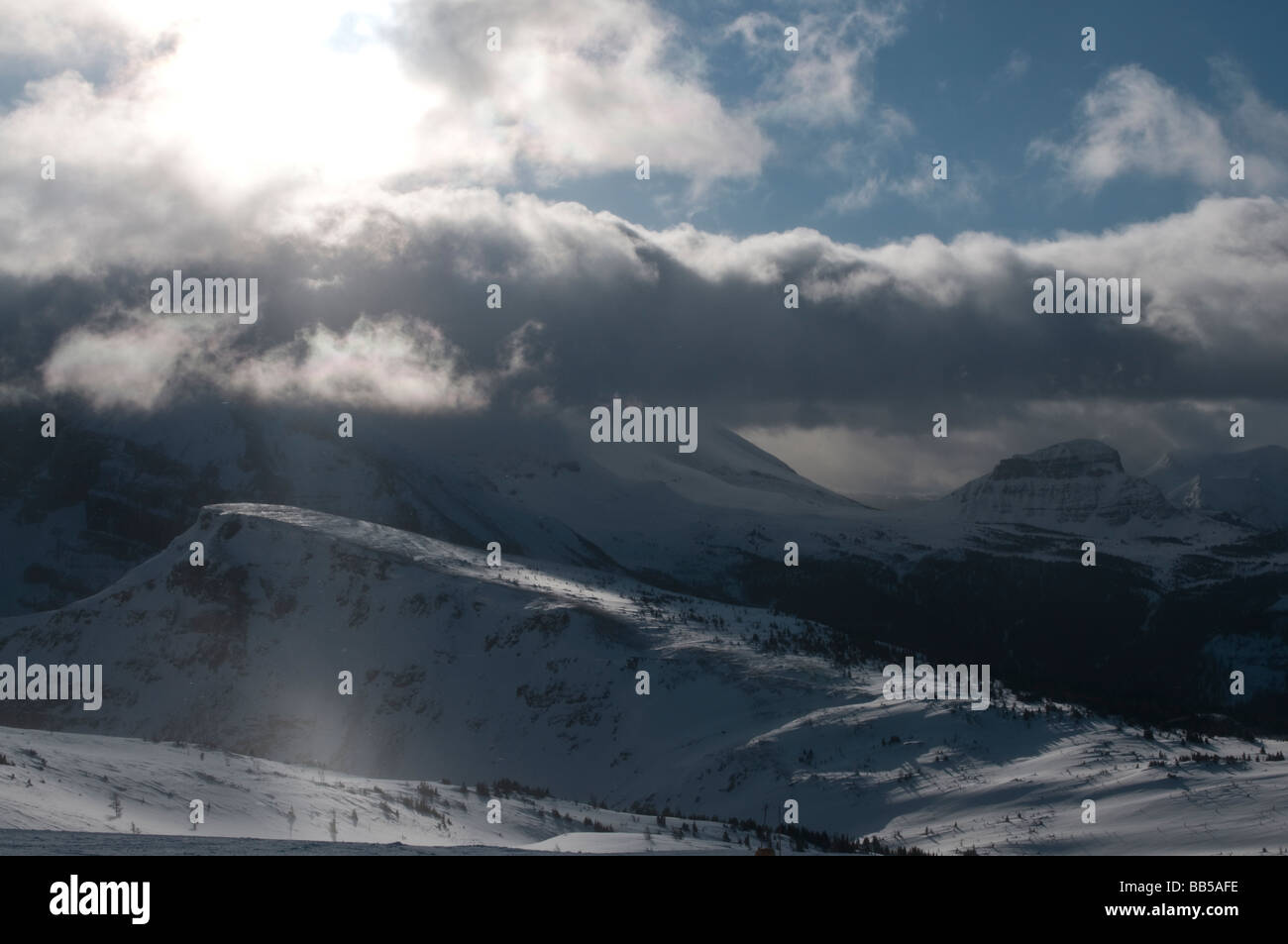 Snow covered ski runs and mountains at the Lake Louise Mountain Resort ...