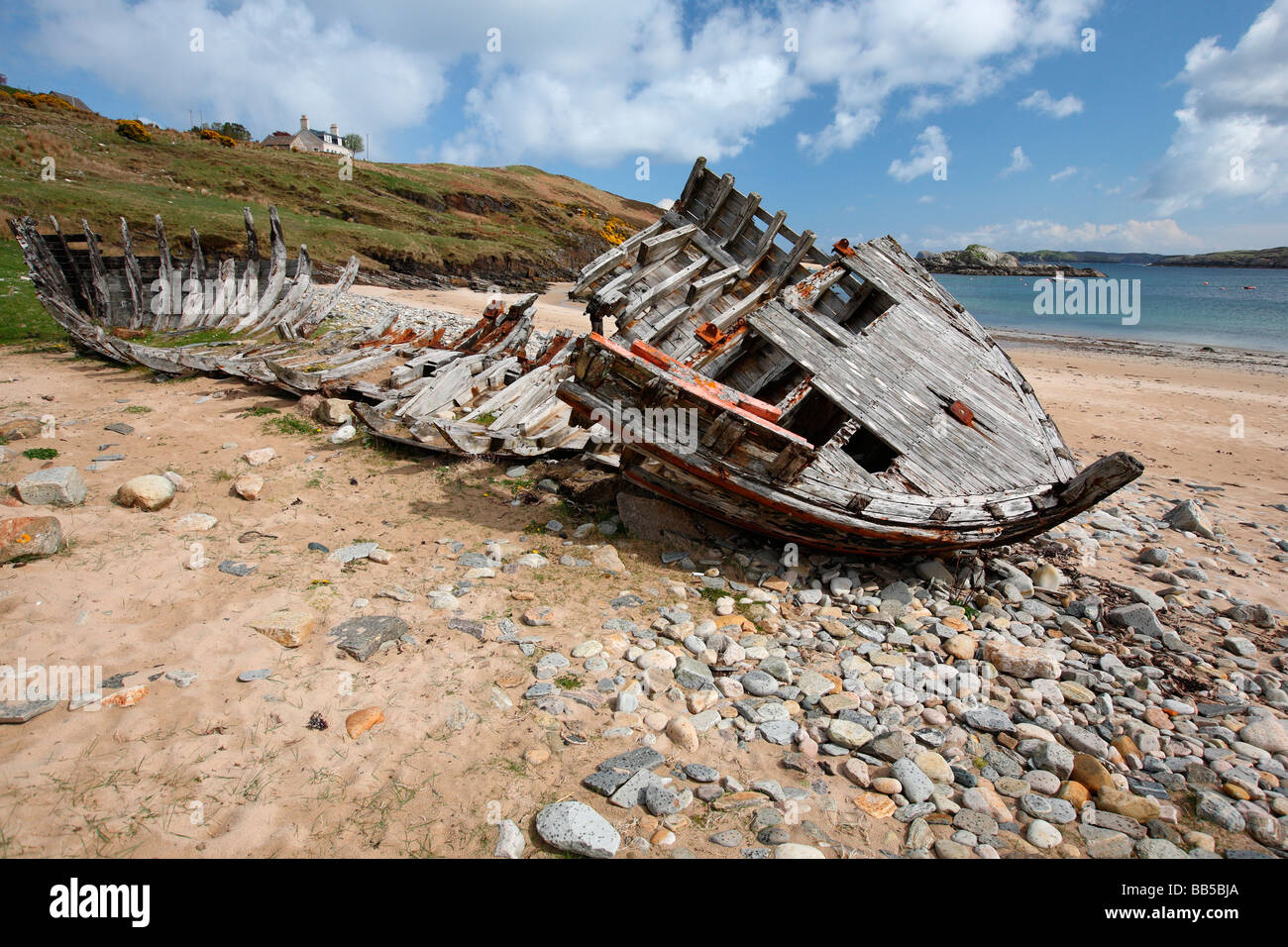 remains of an old wooden boat on the shore of Talmine Bay near Kyle of Tongue Sutherland Northern Scotland Great Britain UK Stock Photo