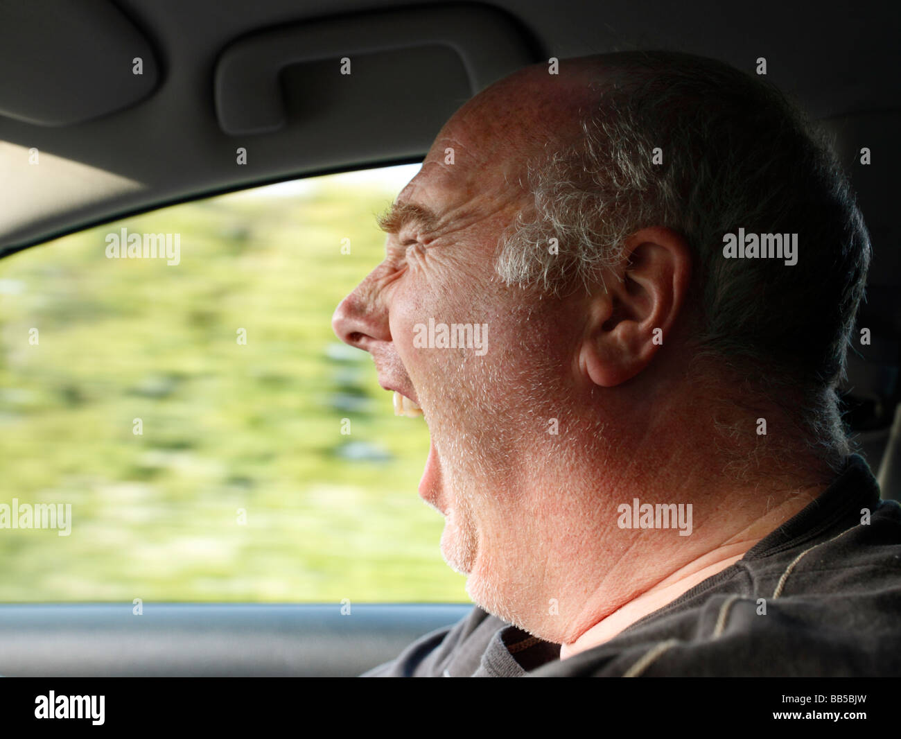 Angry man driving Stock Photo Alamy