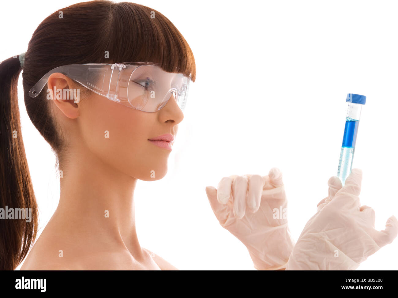beautiful female lab worker holding up test tube Stock Photo - Alamy