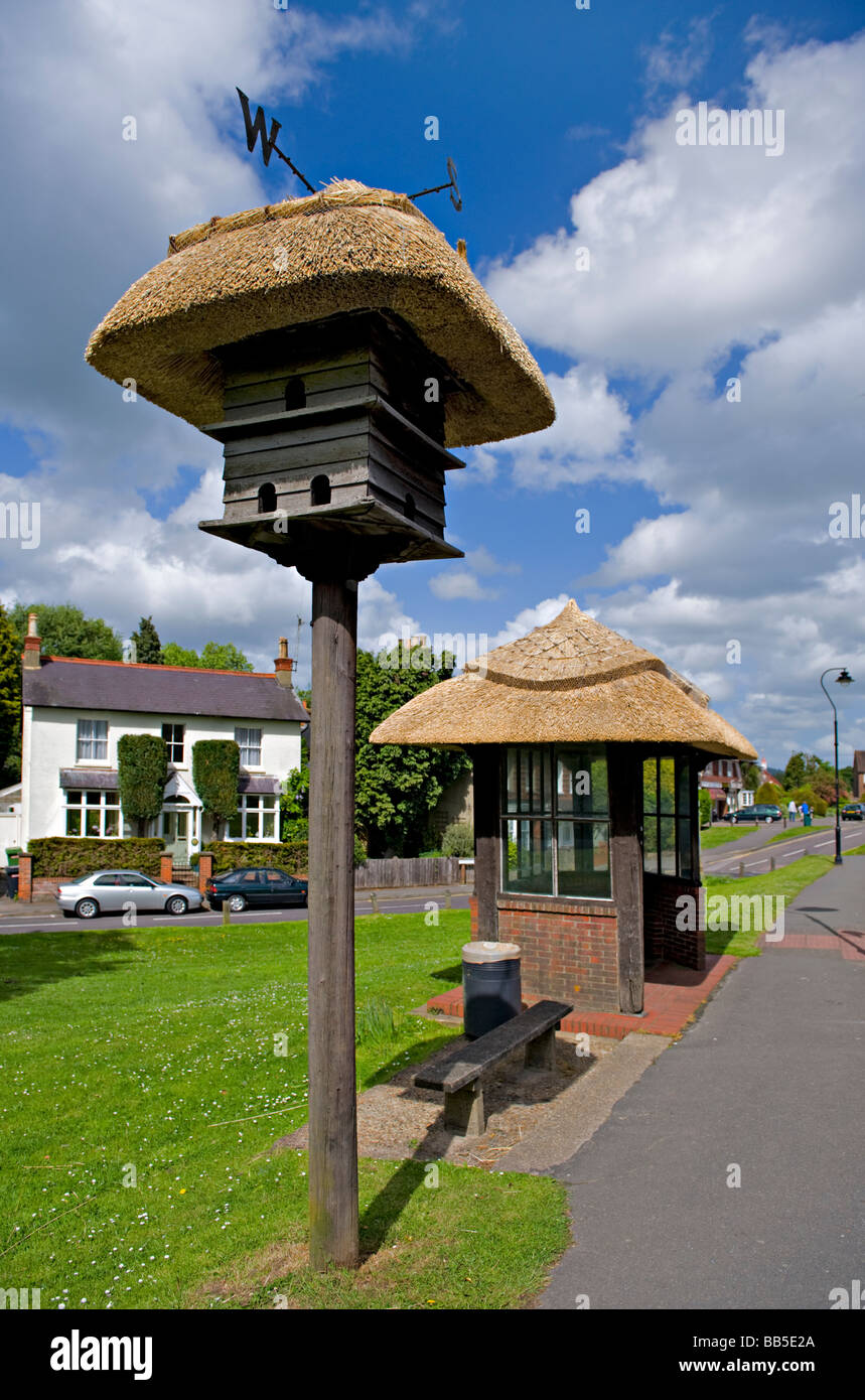 Thatched Dovecote and Bus Shelter in Wescott, Surrey, UK. Stock Photo