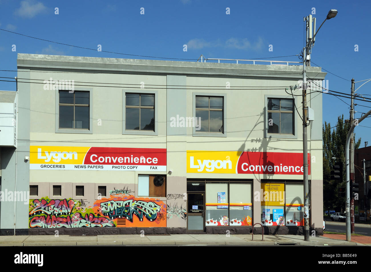 Lygon Convenience Store with colourful graffiti Lygon Street Carlton Melbourne Australia Stock Photo