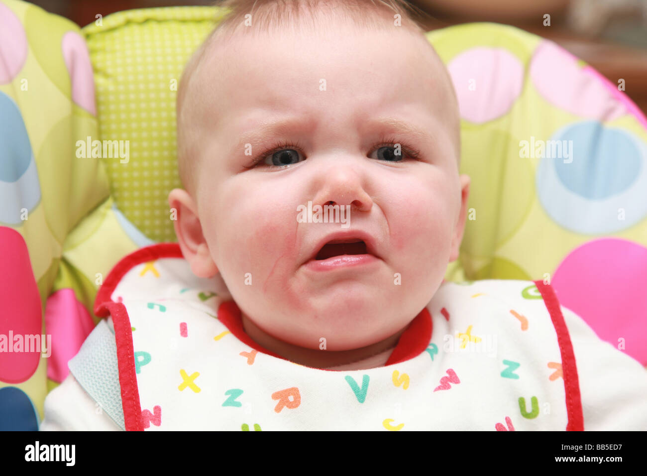 8 month old baby eating and drinking Stock Photo - Alamy