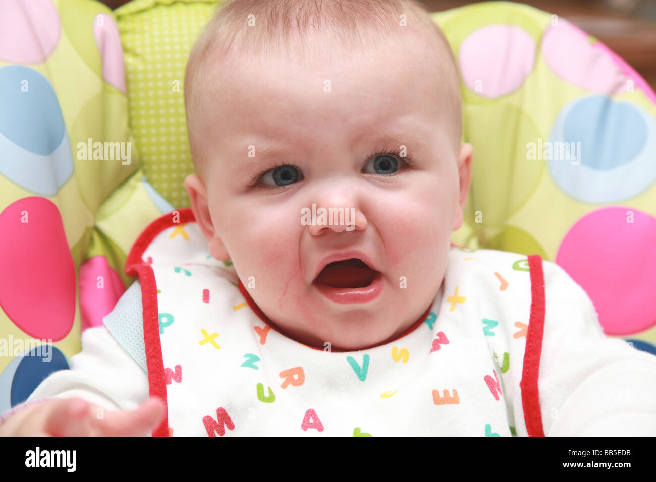 8 month old baby eating and drinking Stock Photo - Alamy