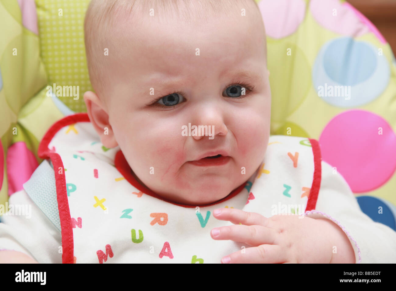 8 month old baby girl tasting food Stock Photo Alamy
