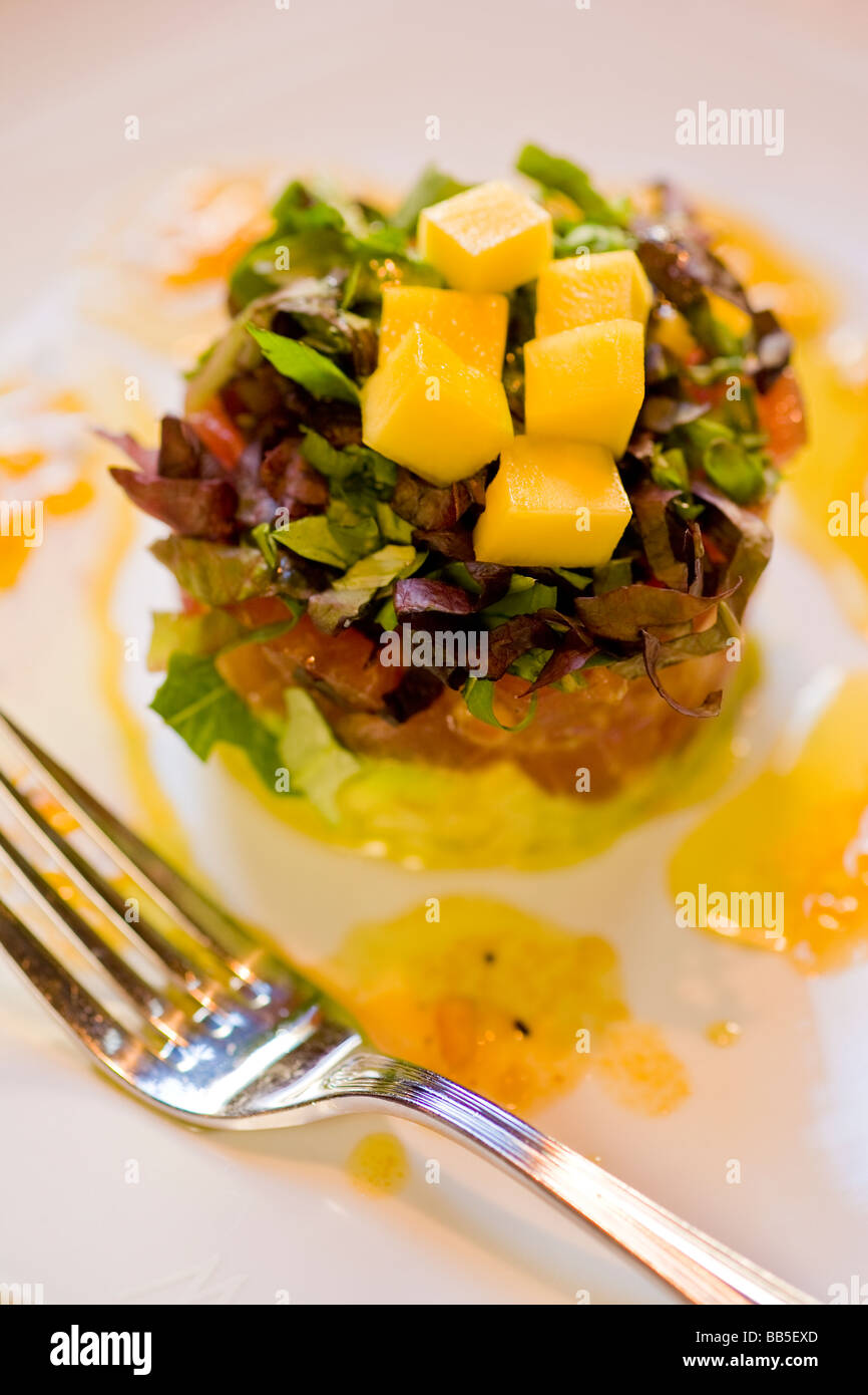 ahi tartare with citrus vinegarette on a bed of avocado Watermark Restaurant Ventura California United States of America Stock Photo