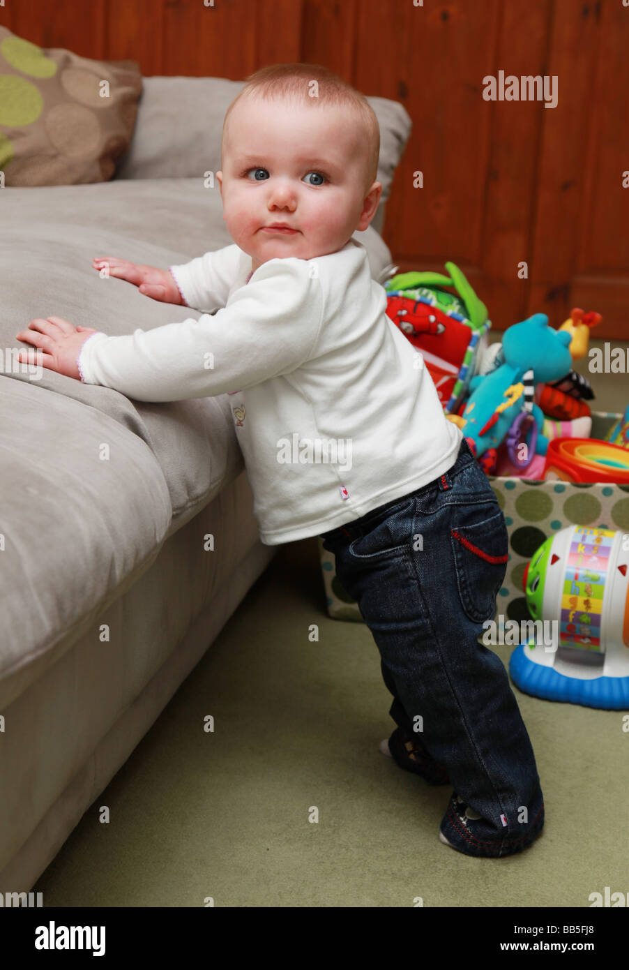 8 month old girl in standing position 