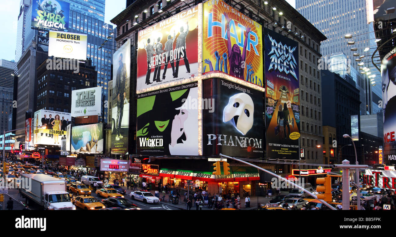 Corner of Times Square at 7th Avenue showing advertisement billboards for Broadway shows in Manhattan New York City Stock Photo