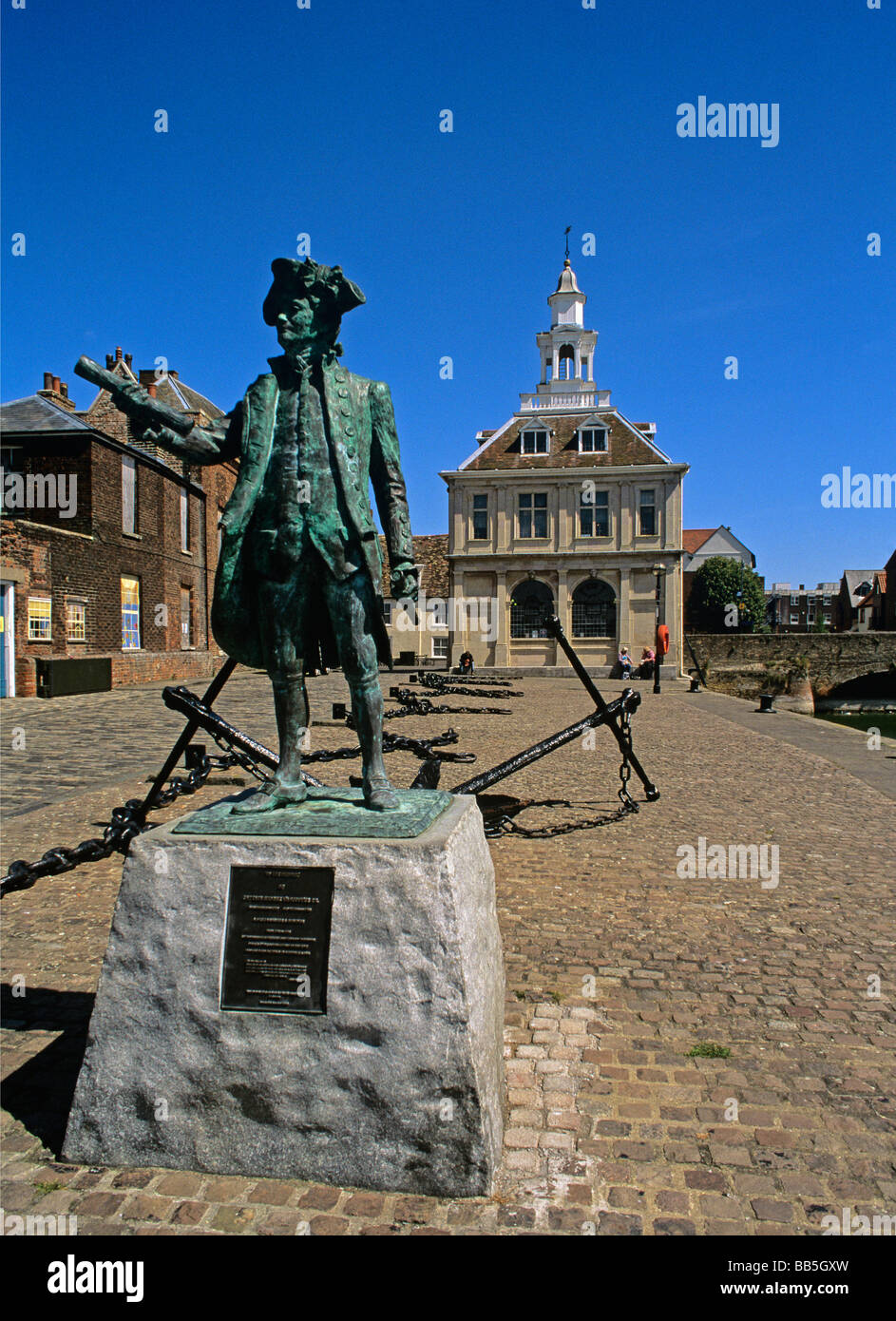 Modern Bronze statue of George Vancouver on the cobbled courtyard of the old Customs House on Kings Lynn waterfront Stock Photo