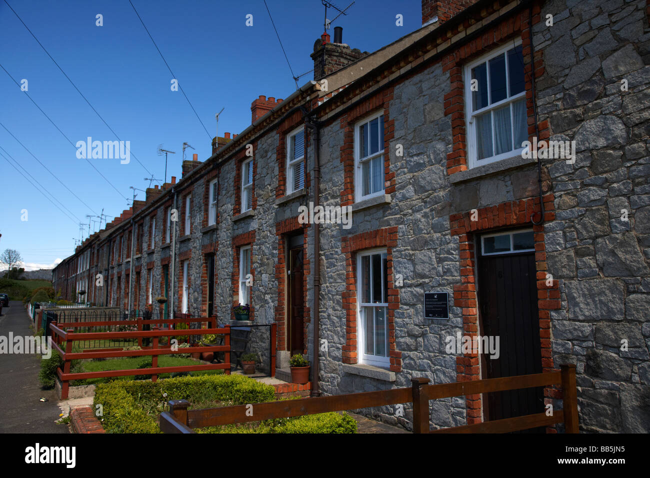 row of granite mill houses on college square east in bessbrook model village county armagh Stock Photo