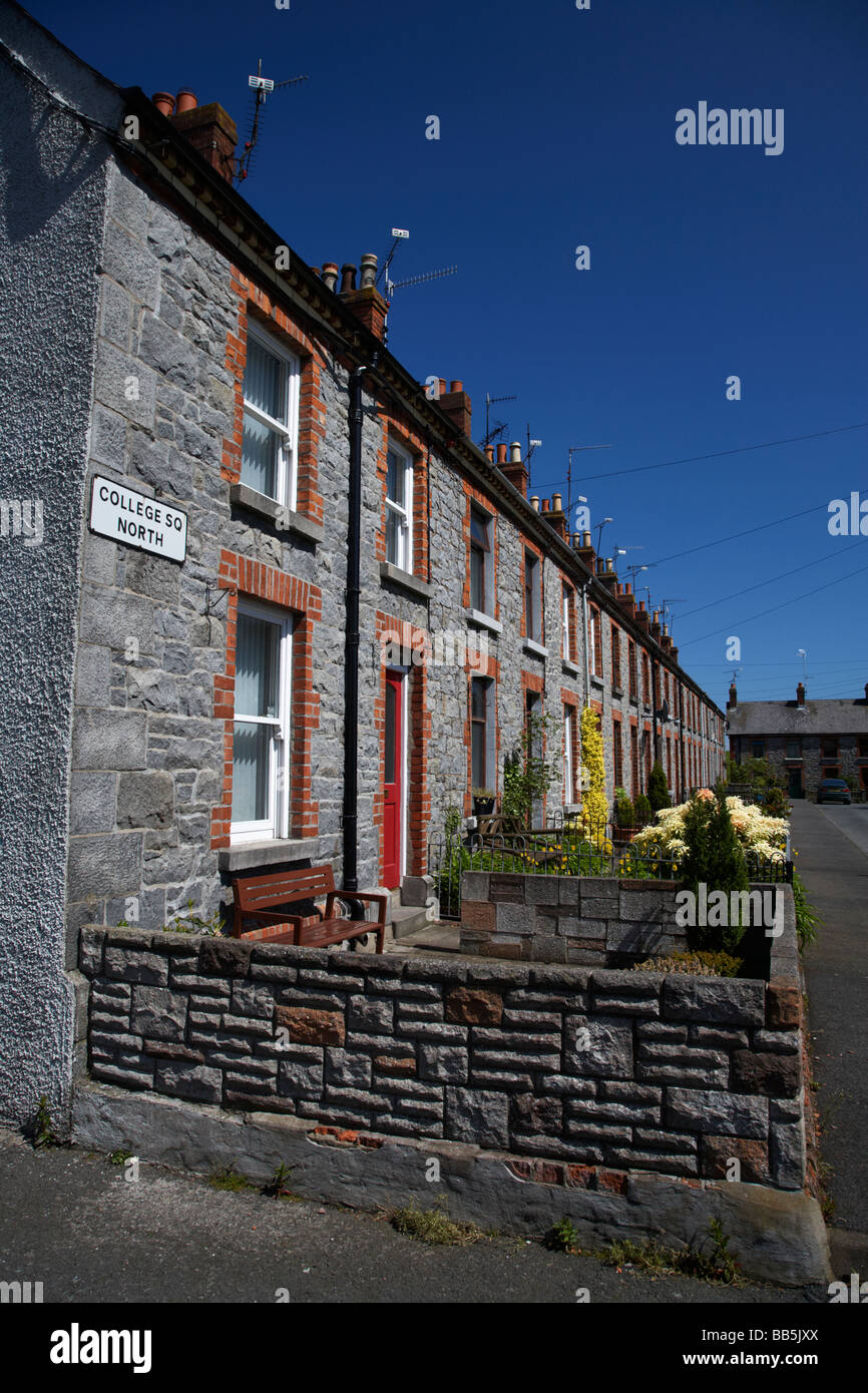 row of granite mill houses on college square north in bessbrook model village Stock Photo