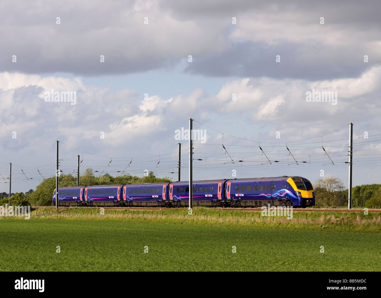 A class 180 Coradia 1000 diesel multiple unit number 180113 working a First Hull Trains service at Langford on the East Coast main Line. Stock Photo