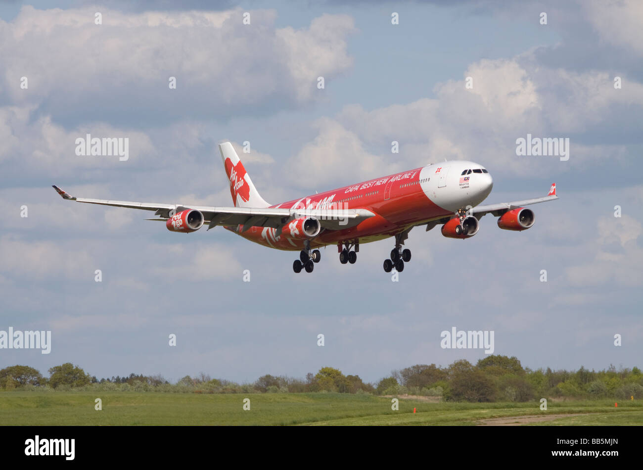 AirAsia X Airbus A340-313X aircraft landing at London Stansted airport. Stock Photo