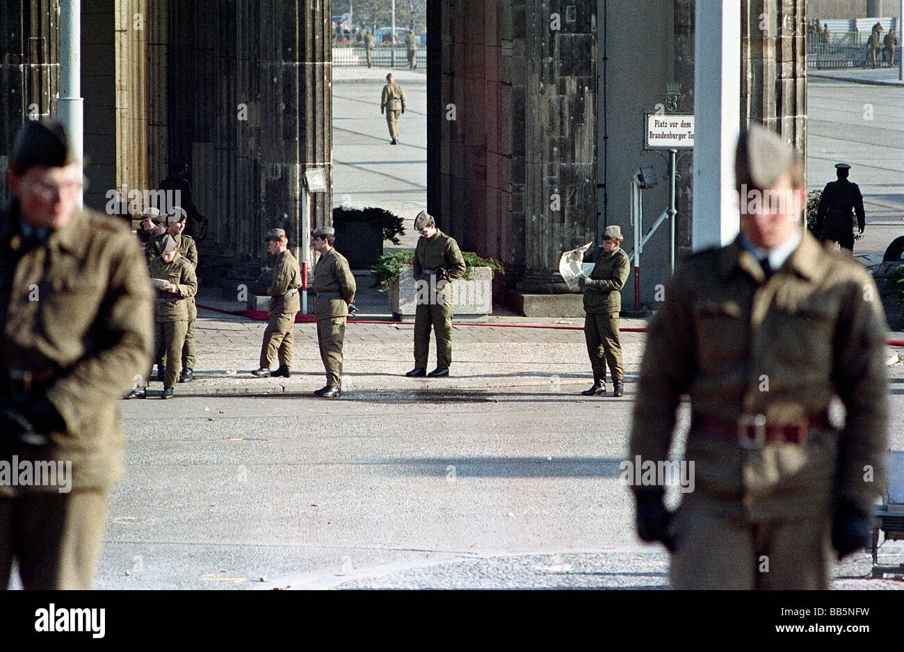 NVA soldiers in front of the Brandenburg Gate in 1989, Berlin, Germany Stock Photo