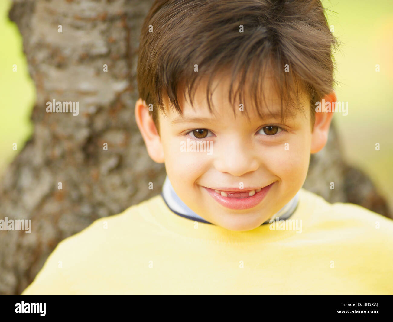 Toothless Hispanic boy smiling Stock Photo