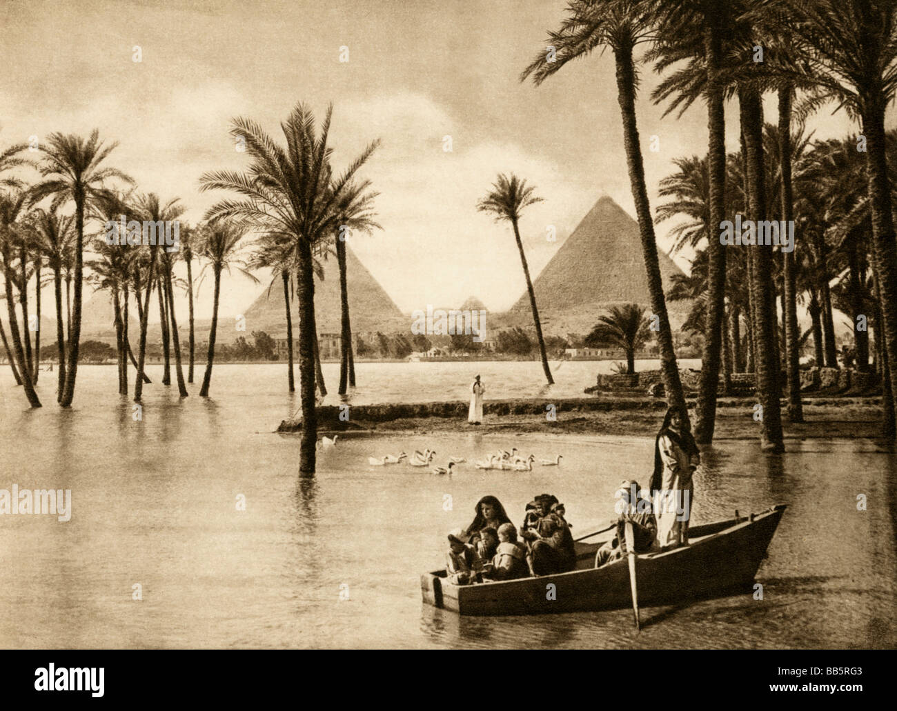 geography / travel, Egypt, Nile at Giza during the inundation, pyramids in the background, 1930s, , Stock Photo
