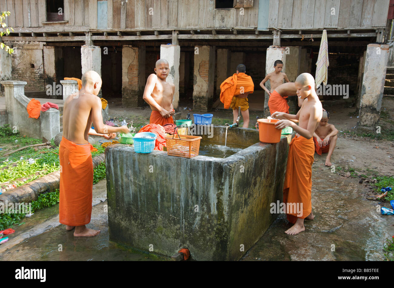 Bath time for novice Buddhist monks at their Luang Prabang temple