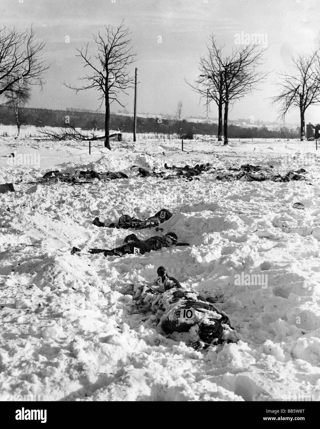 events, Second World War / WWII, war crimes, Malmedy massacre 17.12.1944, marked corpes of American soldiers shot by Waffen-SS task force "Peiper", 1st SS Panzer Division "Leibstandarte Adolf Hitler", Stock Photo