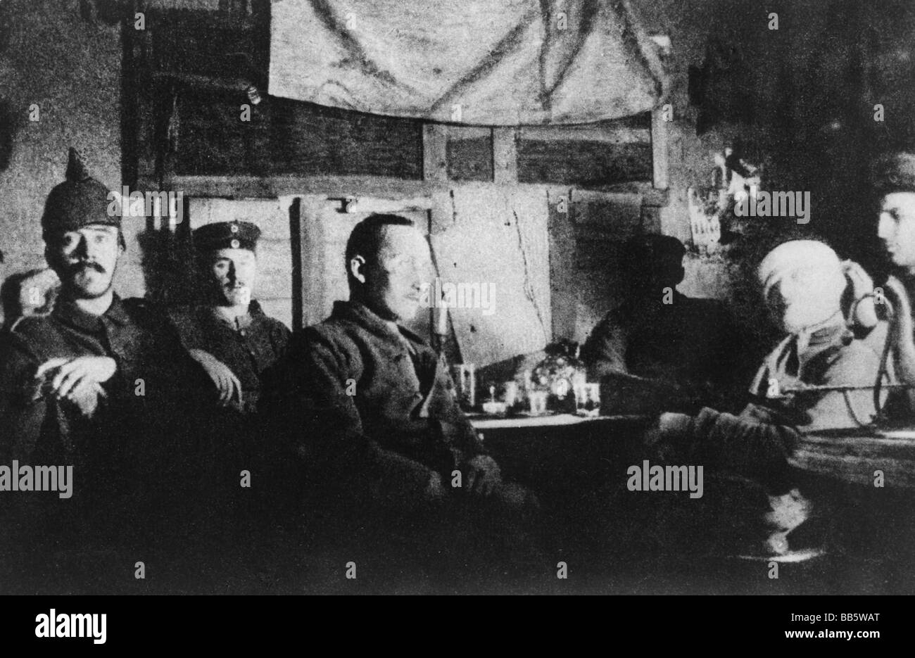 Hitler, Adolf, 20.4.1889 - 30.4.1945, German politician (NSDAP), Fuehrer and Reich Chancellor since 1933, during First World War, WWI, with comrades in a shelter on the Western Front 1914/1915, (left, with Pickelhaube), group picture, Stock Photo