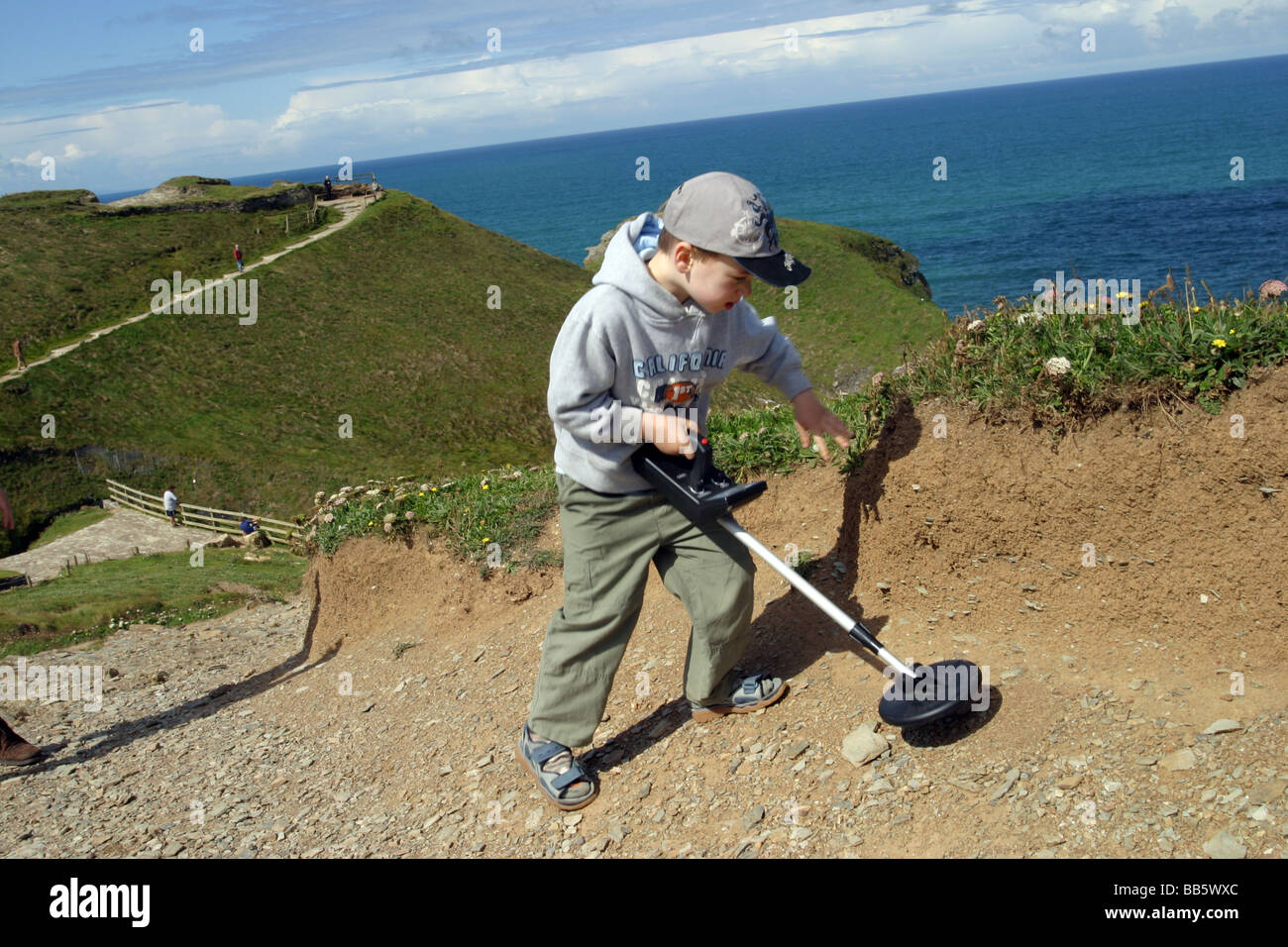 young boy using a metal detector, Cornwall Stock Photo Alamy