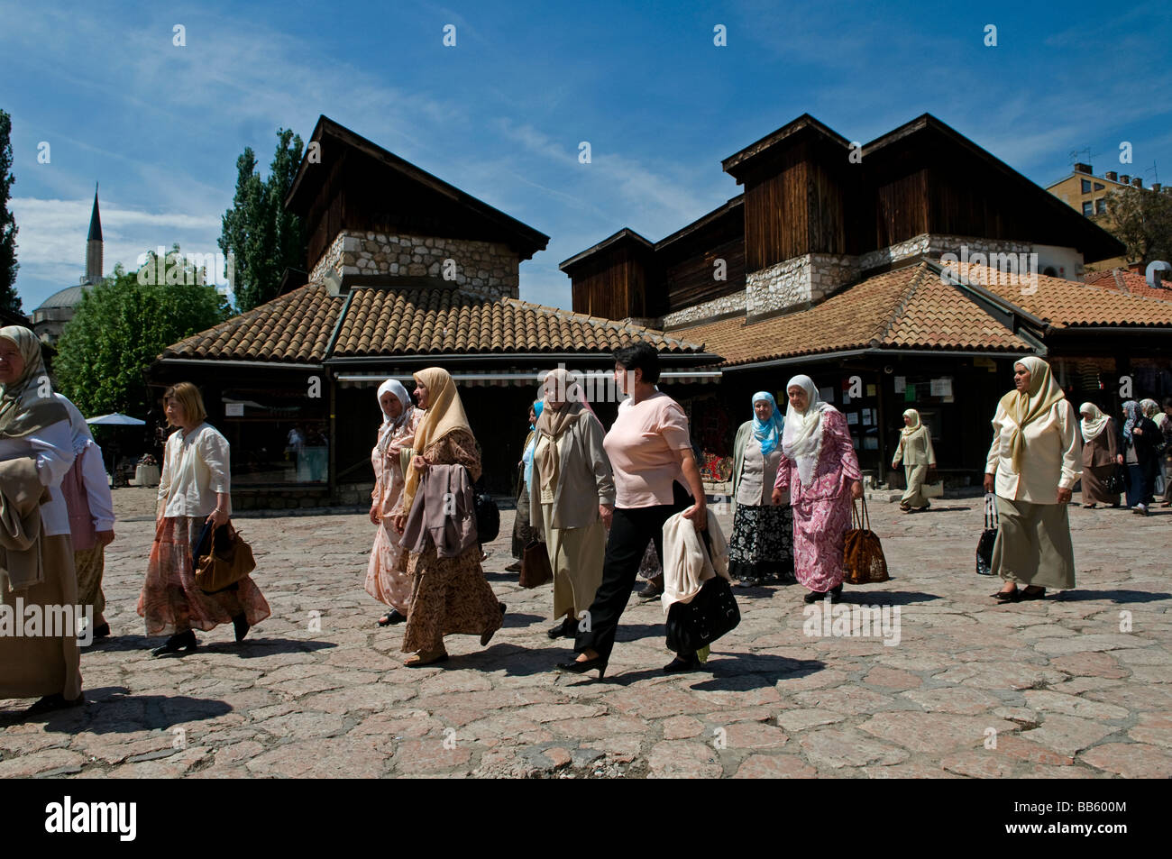 Muslim Bosniak women walk in Bascarsija district, the old town market sector in Sarajevo, Bosnia and Herzegovina Stock Photo