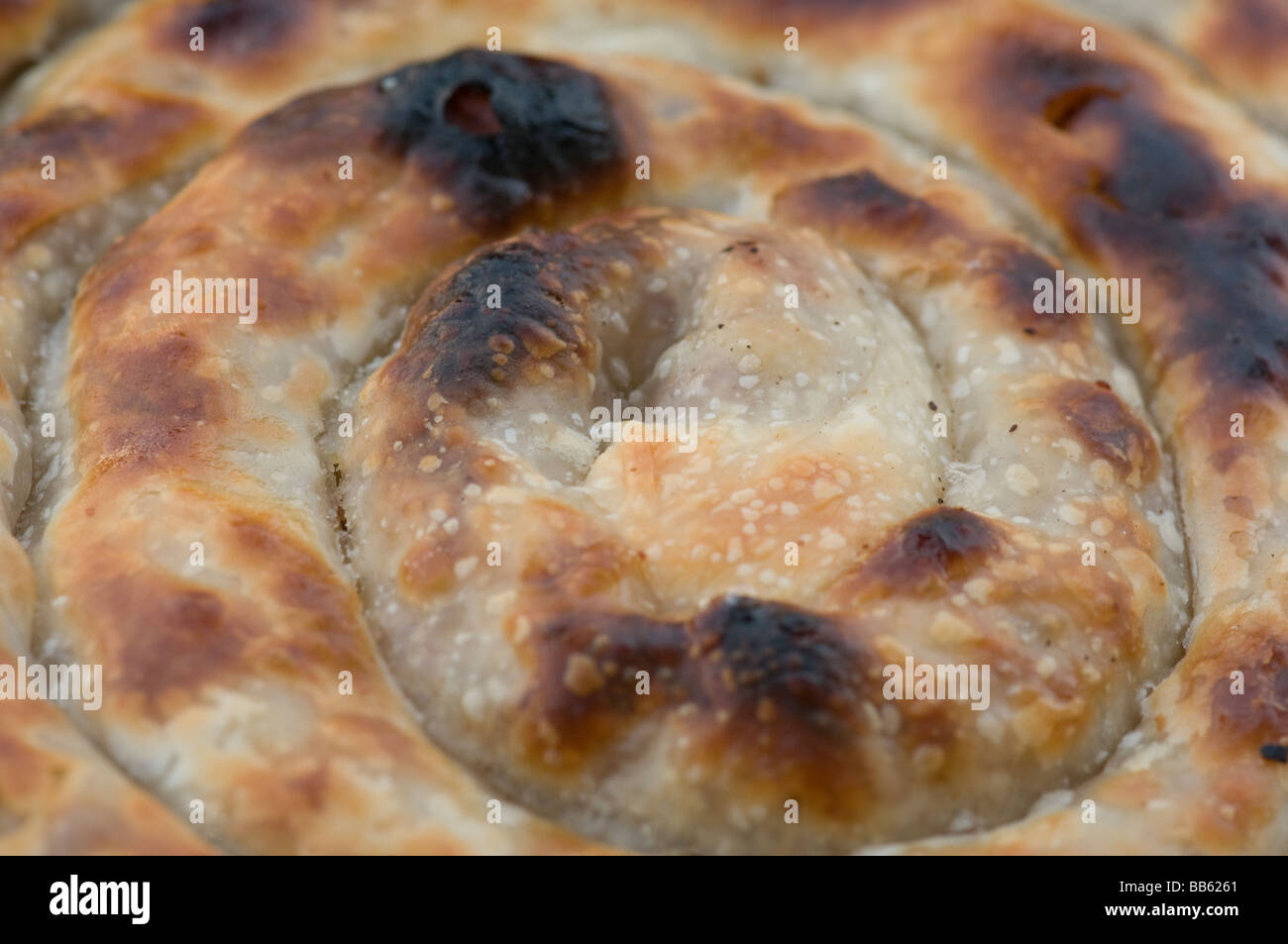 Close up of a Bosnian rolled Burek or Borek Pastry made of a thin flaky dough such as phyllo or yufka. Bosnia Stock Photo