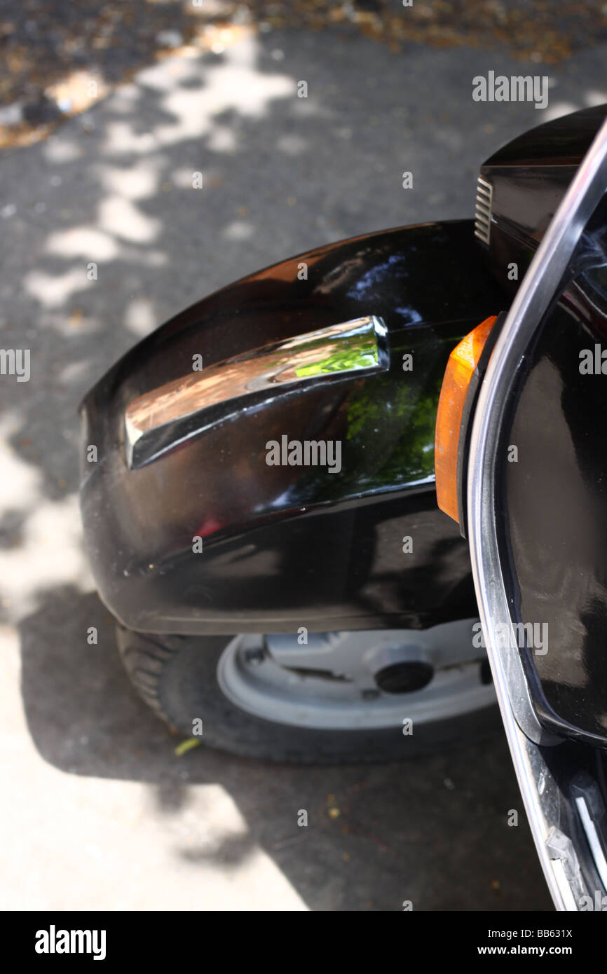 Details of a black Vespa scooter in Rome, Italy. Stock Photo