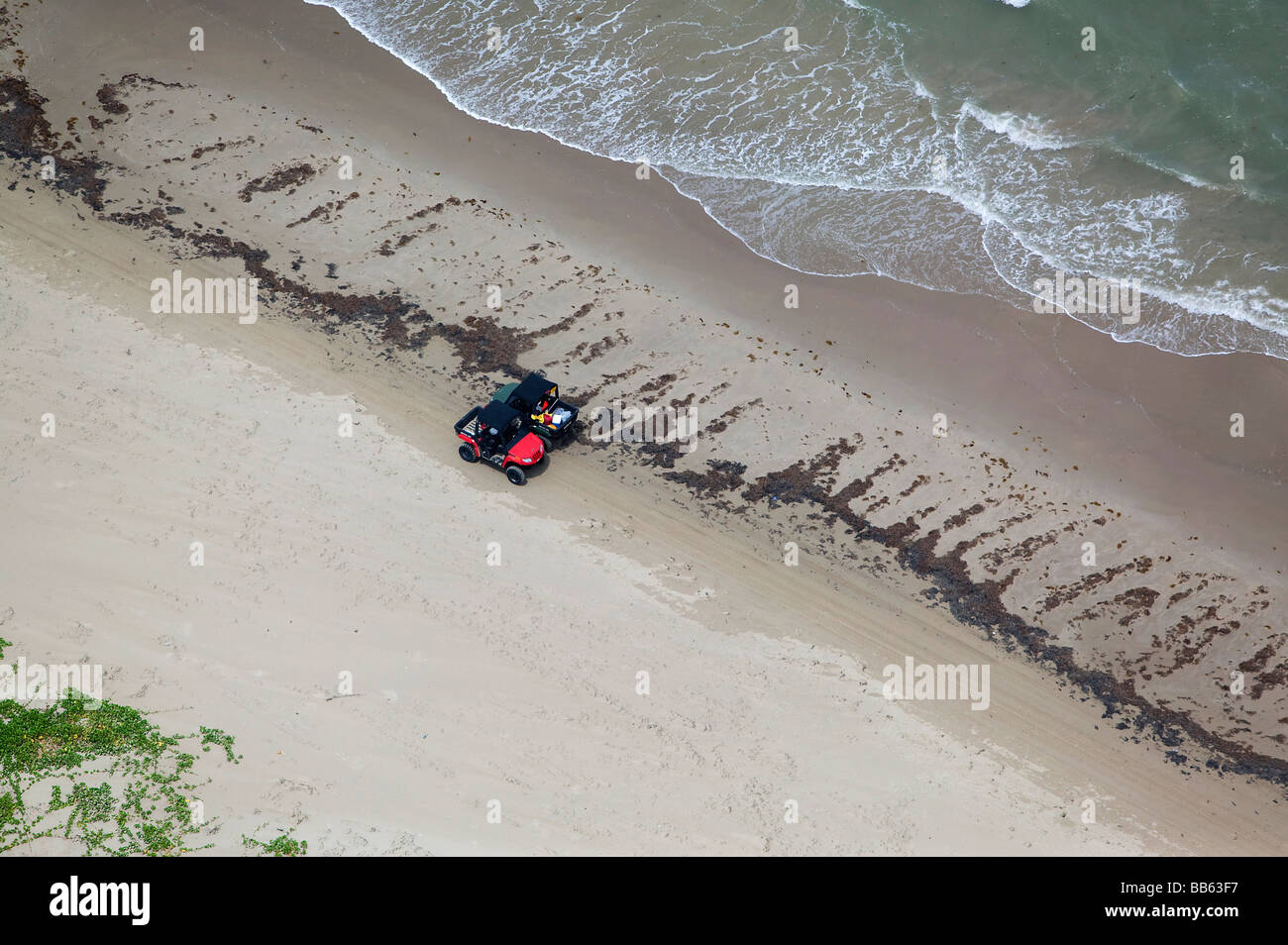 aerial view above two quads parked on Padre Island Texas beach Stock Photo