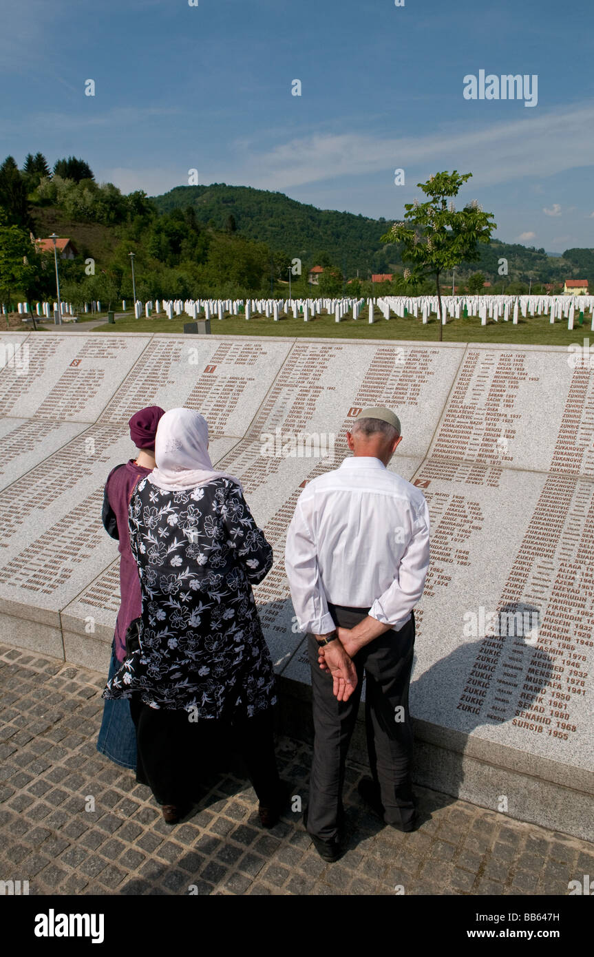 Bosniaks reading wall of names at Srebrenica Potocari Genocide memorial and cemetery for over 8000 victims of 1995 Genocide in Bosnia and Herzegovina Stock Photo