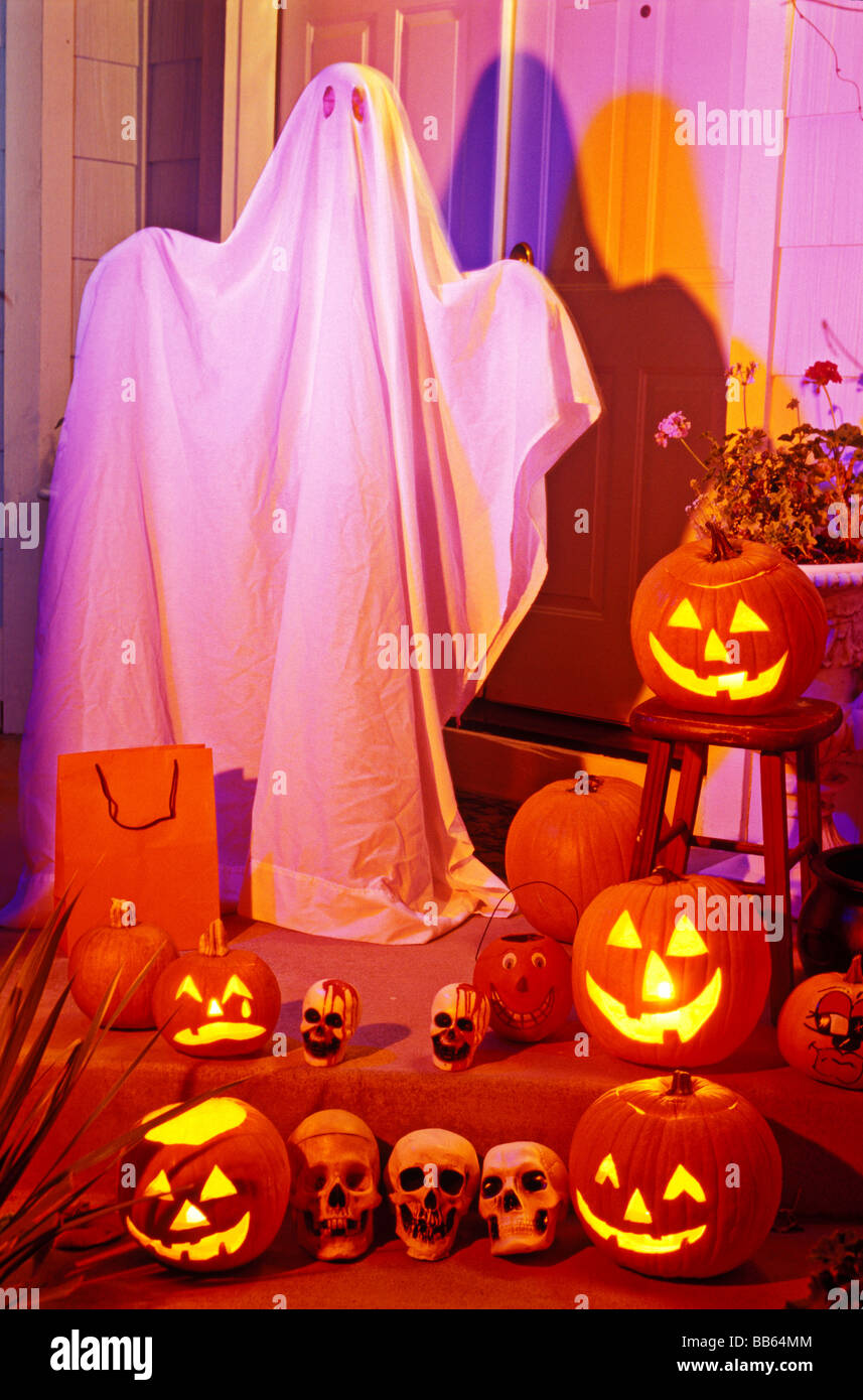 Ghost on front porch with pumpkins Stock Photo