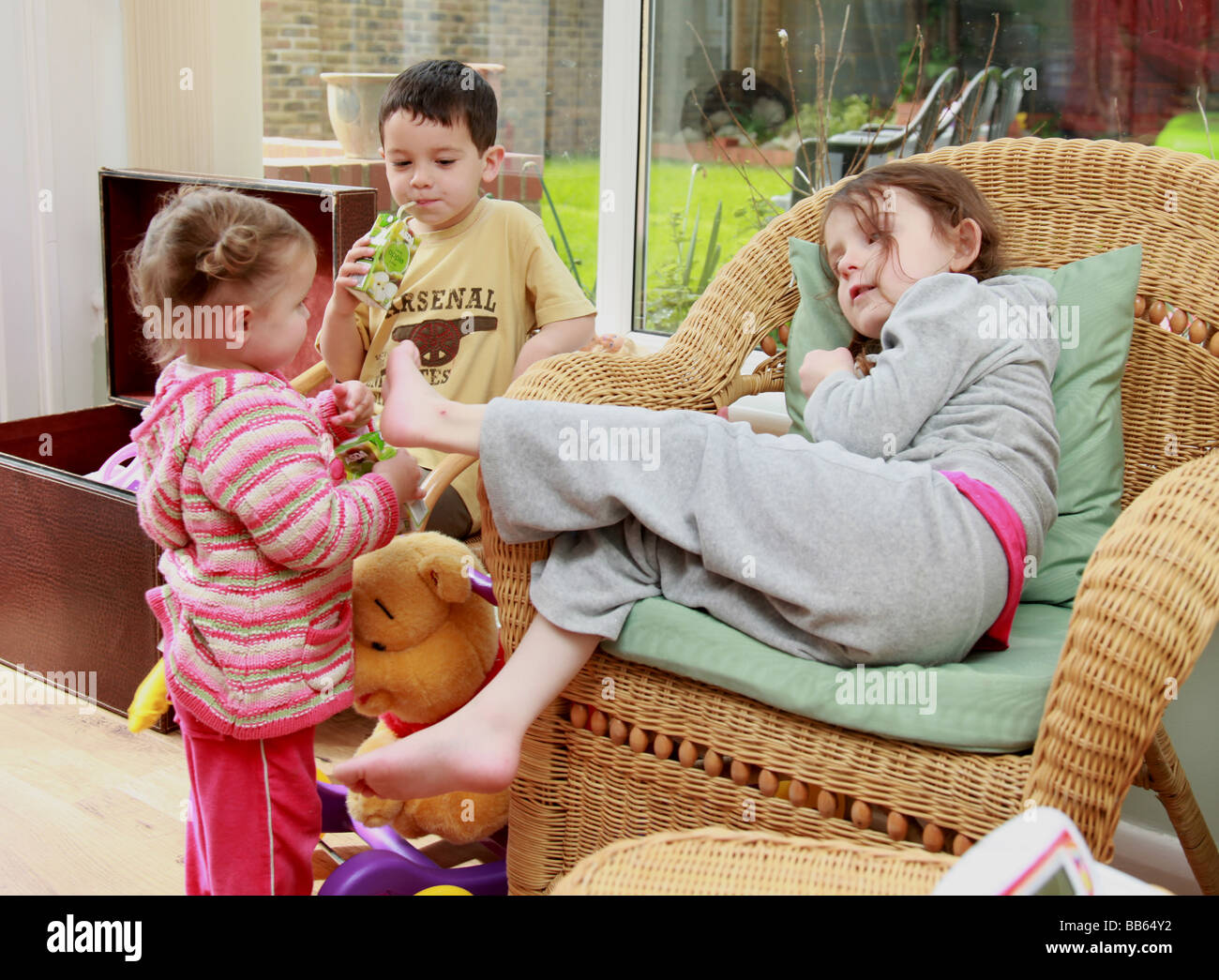 Bored Children entertaining themselves in the summer holidays Stock