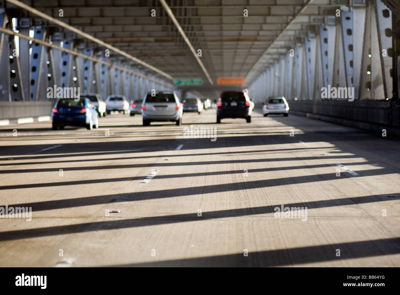 Autos travel East on the lower level of the Bay Bridge between San Francisco to Oakland in the morning. © Craig M. Eisenberg Stock Photo